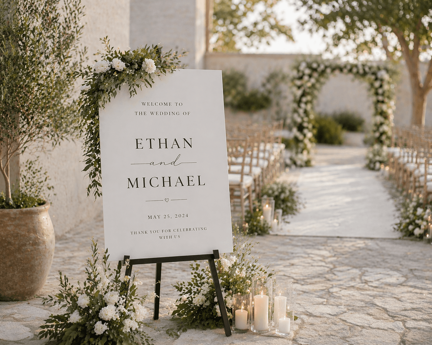 Elegant wedding welcome sign for Ethan and Michael at an outdoor ceremony with floral decor.
